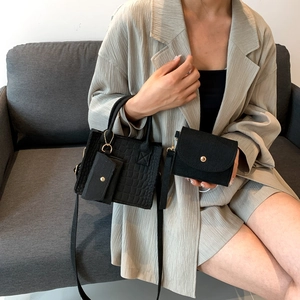 Three-piece black crocodile pattern handbag set with crossbody strap and small pouches
