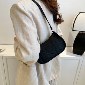 Minimalist black quilted shoulder bag with geometric stitching for women fashion