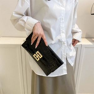 Minimalist black crocodile pattern envelope clutch with golden geometric clasp
