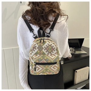 Detail of colorful ethnic woven mini backpack featuring vibrant geometric patterns