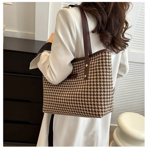Classic houndstooth tote bag shown from a side view on model for everyday commute use
