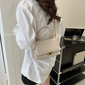 Chic beige crocodile-embossed small square crossbody bag with elegant gold metal lock