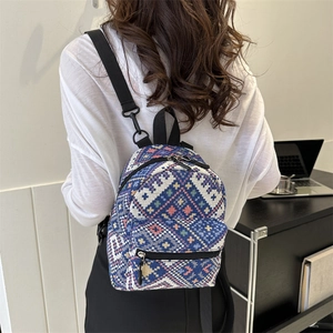 Ethnic bohemian mini backpack with colorful geometric weaving and black nylon straps