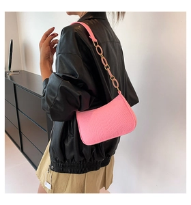 Pink crocodile pattern crescent shoulder bag with metallic chain strap detail