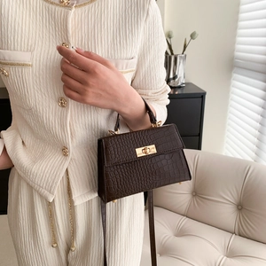 Deep brown crocodile texture mini satchel with golden clasp and adjustable shoulder strap