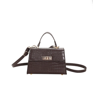 Dark brown faux crocodile leather handbag with gold metal clasp and top handle