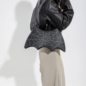 Gothic bat-shaped shoulder bag with spider web pattern and heart detail in black PU leather