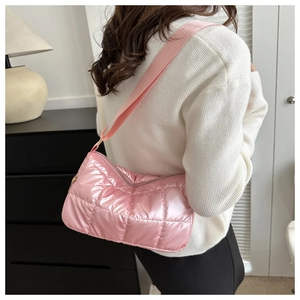 Pink quilted down shoulder bag featuring glossy nylon fabric and matching wide strap