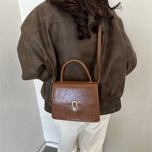 Brown retro square crossbody bag with gold seashell clasp and top handle for women