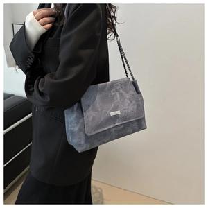 Retro grey marble texture tote bag with chain strap styled on a black blazer
