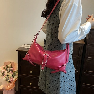 Trendy rose pink patent leather shoulder bag with silver buckles for modern women