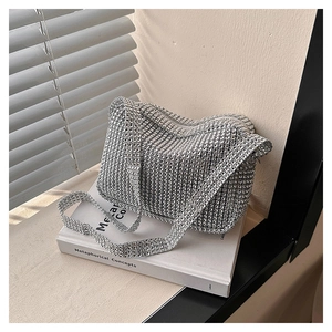 Detail showing high-quality silver rhinestones on a stylish square shoulder bag