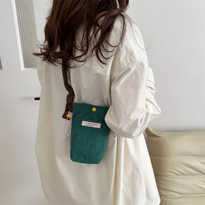 Minimalist green corduroy crossbody phone bag for women with stylish yellow metal snap