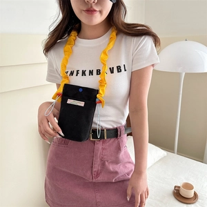 Minimalist black corduroy mobile phone crossbody bag with yellow ruffled shoulder strap