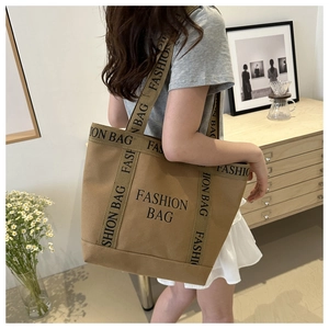 Close-up of khaki canvas tote bag with black Fashion Bag print and large capacity