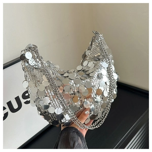 Detail of silver sequin hobo bag with moon shape and double metallic chain straps
