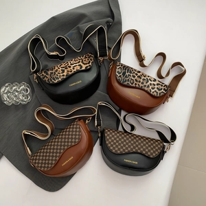 Group shot of four saddle bags in black and brown featuring leopard and dot patterns