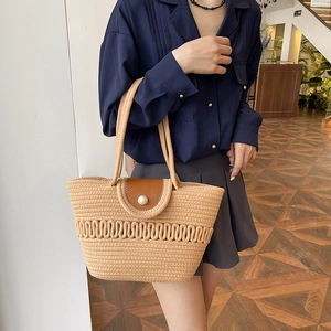 French straw woven tote bag with pearl closure and leather flap for beach vacation style