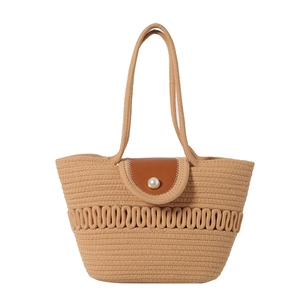 French straw woven beach bag with wavy hollow detail, leather flap and pearl button