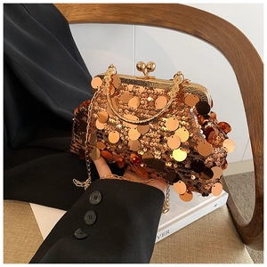 Close-up of rose gold sequin clutch with vintage metal clasp and chain strap detail