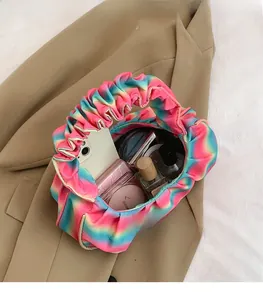 Internal view of rainbow gradient cloud bag showing large capacity for personal essentials