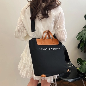 Bolso tote de lona vintage de gran capacidad con adornos de cuero marrón y texto