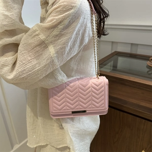 Chic pink chevron quilted crossbody bag with golden chain strap for women in 2024 fashion