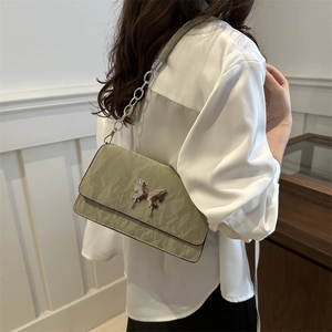 Chic olive green chain shoulder bag with butterfly metal accent and pleated texture