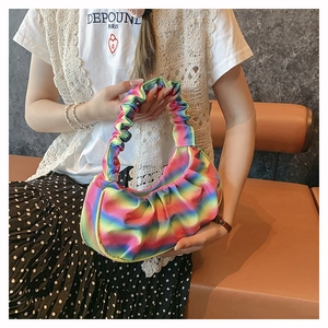 Detail of a rainbow gradient pleated crescent bag with lightweight textured fabric finish