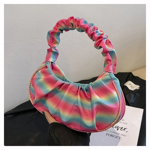 Detailed view of rainbow gradient cloud bag featuring pleated fabric and scrunchie handle