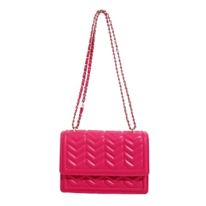 Minimalist rose red chevron quilted crossbody bag with gold chain strap on white background