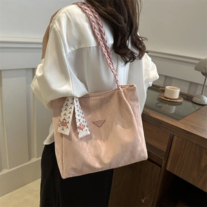 Pink large capacity tote bag with braided shoulder strap and decorative silk scarf