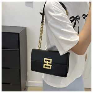 Fashionable black matte leather shoulder bag with gold chain strap and H-buckle detail