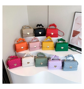 Detailed display of 12 colorful quilted handbags with heart buckles and cloud handles