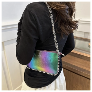 Macro detail of holographic gradient crossbody bag with silver metallic bead trim