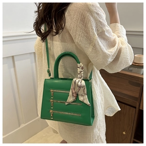 Crossbody tote in bright green faux leather with silk scarf detail on shoulder