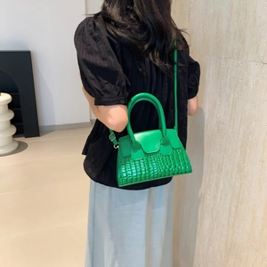 Minimalist green crocodile pattern shoulder bag with circular handles for women