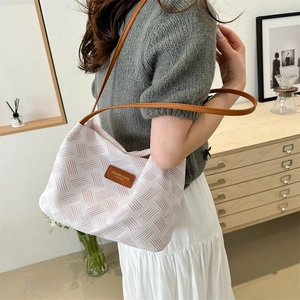 Stylish woven white and pink tote bag with brown leather straps for summer casual wear