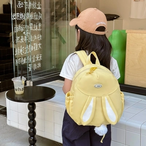 Cute yellow children's backpack with 3D bunny ears and white pom-pom detail