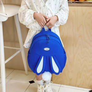 Sweet girls blue backpack with cute white rabbit ears and soft pompom decoration