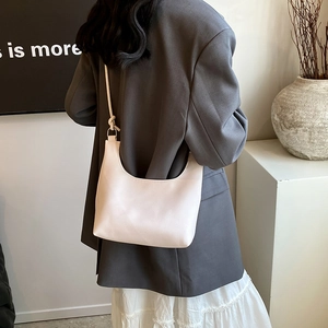Minimalist cream shoulder bag with litchi texture and knotted strap in fashion style