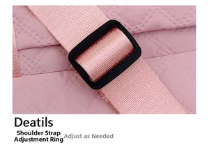Detail of pink quilted sports bag featuring an adjustable shoulder strap and buckle
