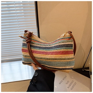 Detail showing the colorful woven texture and brown leather strap with knot decoration