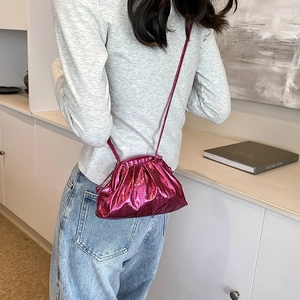 Chic fuchsia metallic pleated crossbody dumpling bag for women with slim shoulder strap