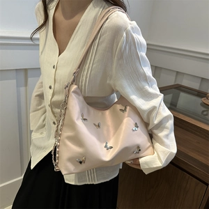 Pink butterfly tote bag with silver metallic accents and chain strap for women