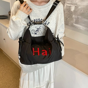 Black casual nylon tote bag with red Hai embroidery and adjustable strap for women