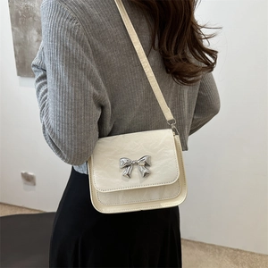Elegant cream white square shoulder bag with pleated leather and silver bow buckle