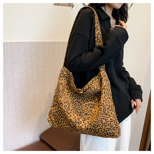 Detail shot of large leopard print tote bag with spacious interior for casual daily use