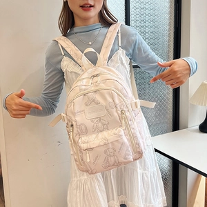 Pink lightweight school backpack with cute teddy bear print for teenage girls and students