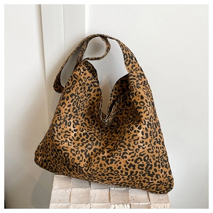 Macro shot of large leopard print tote bag texture and high-capacity canvas fabric